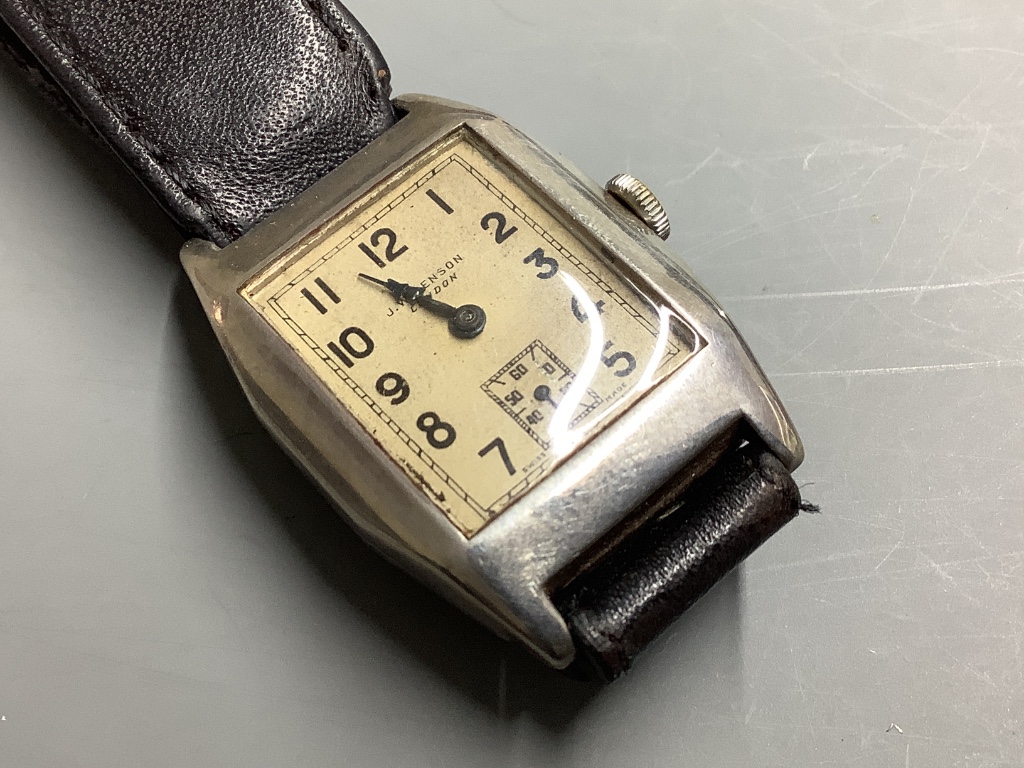 A gentleman's 1930's silver J.W. Benson manual wind wrist watch, on a leather strap.